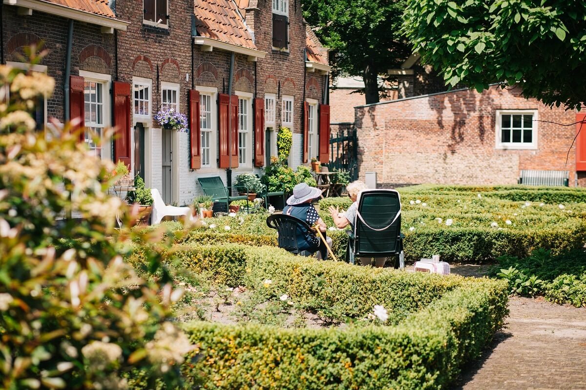 people sitting in chairs in garden