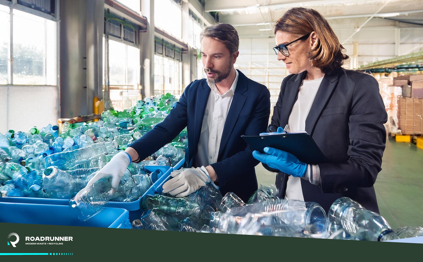 two employees sort through their trash and recycling for a waste and recycling audit