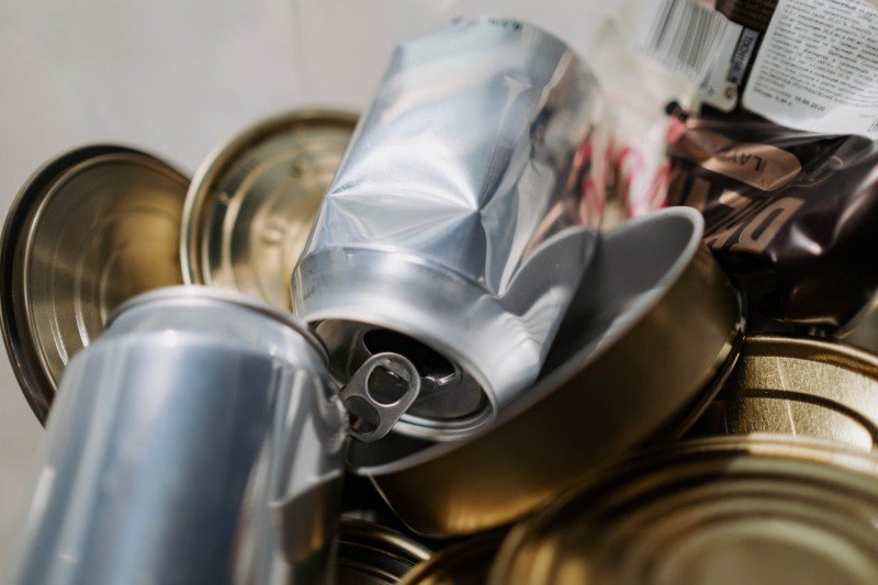 Assorted empty metal food containers