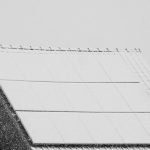 rooftop solar panels covered with snow