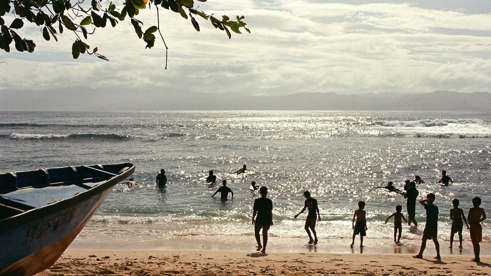 Children play on the beach and frolic in the sea in Morotai, an island in Indonesia.