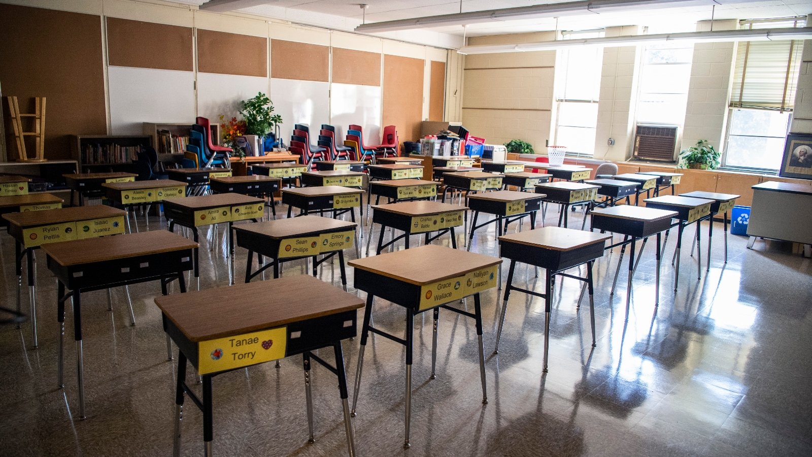 A classroom filled with empty desks