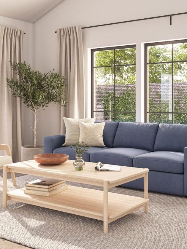 Blue sofa and light wood coffee table from sustainable furniture company Medley