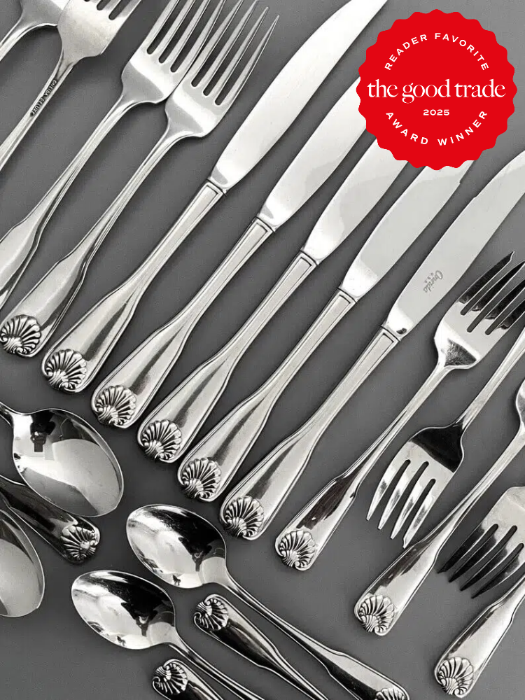 A set of silver cutlery including forks, knives, and spoons arranged neatly on a gray surface. A "Reader Favorite 2025 Award Winner" badge is in the top right corner.