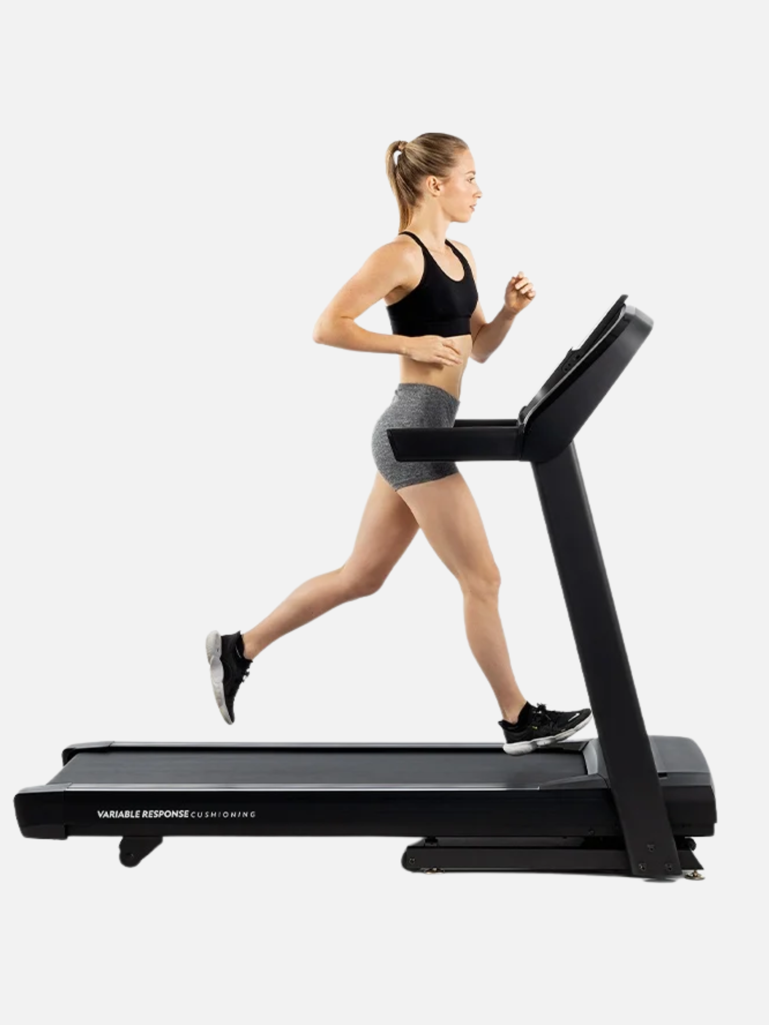 Person in athletic wear running on a treadmill.