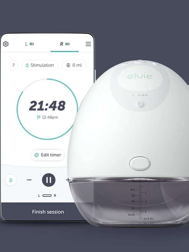 The Elvie Breast Pump next to the phone app.