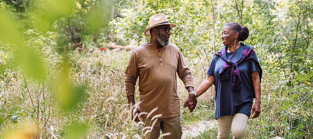 A couple hiking along a nature trail