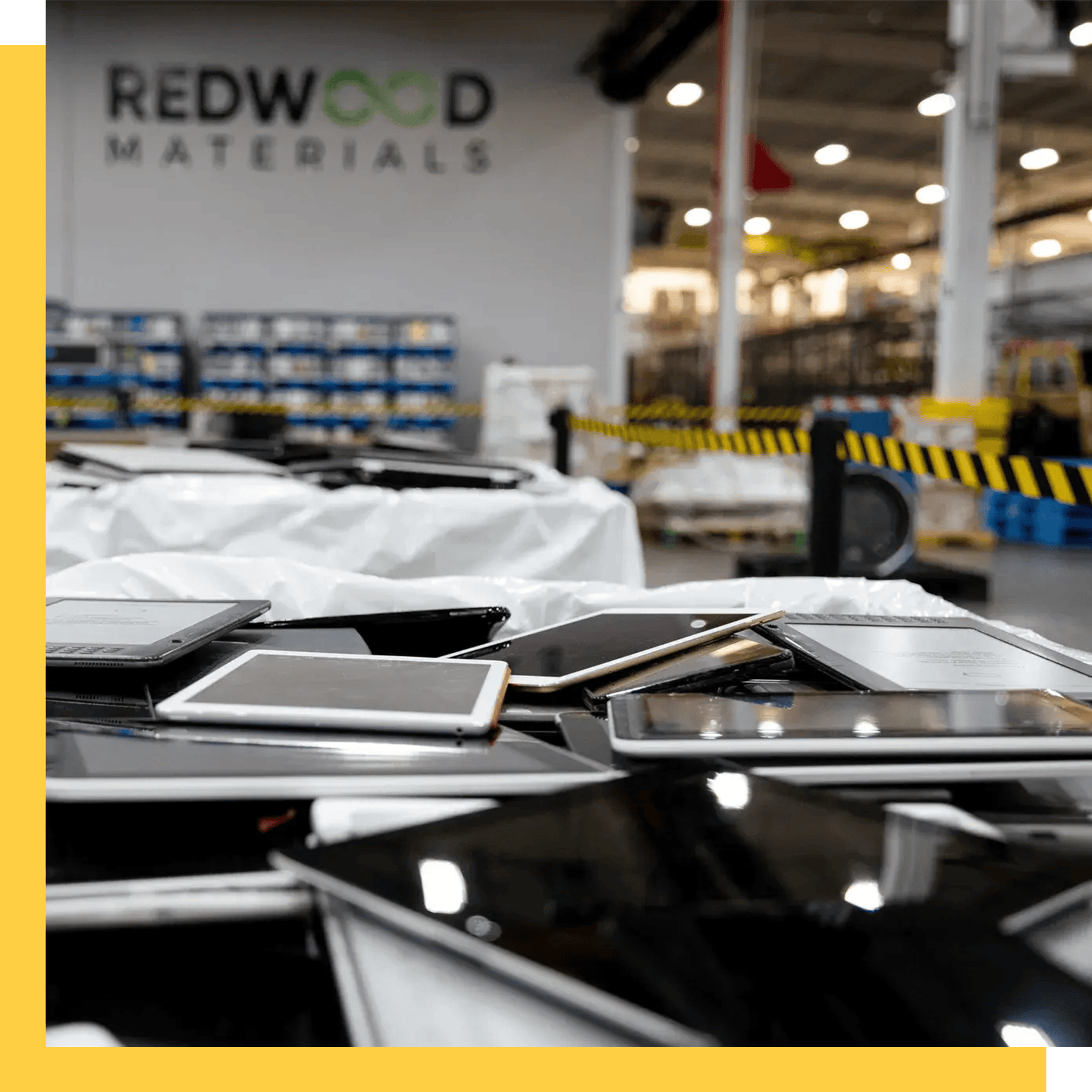 A pile of tablets on a tabletop at a battery recycling facility