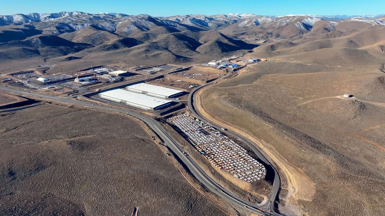 an aerial view of a large industrial building in the desert
