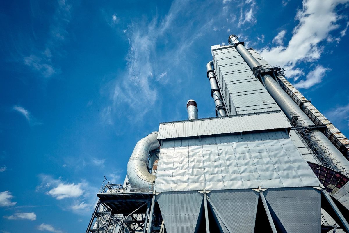 A large industrial structure set against a blue sky, presumably a building at Padeswood Cement Works