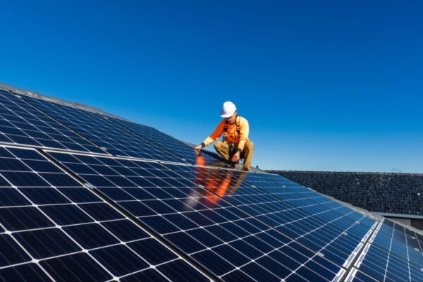 A man installing solar panels