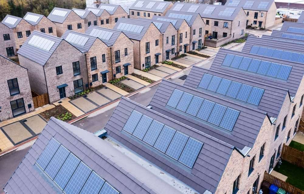 Terraced new build homes with solar panels on the rooftops
