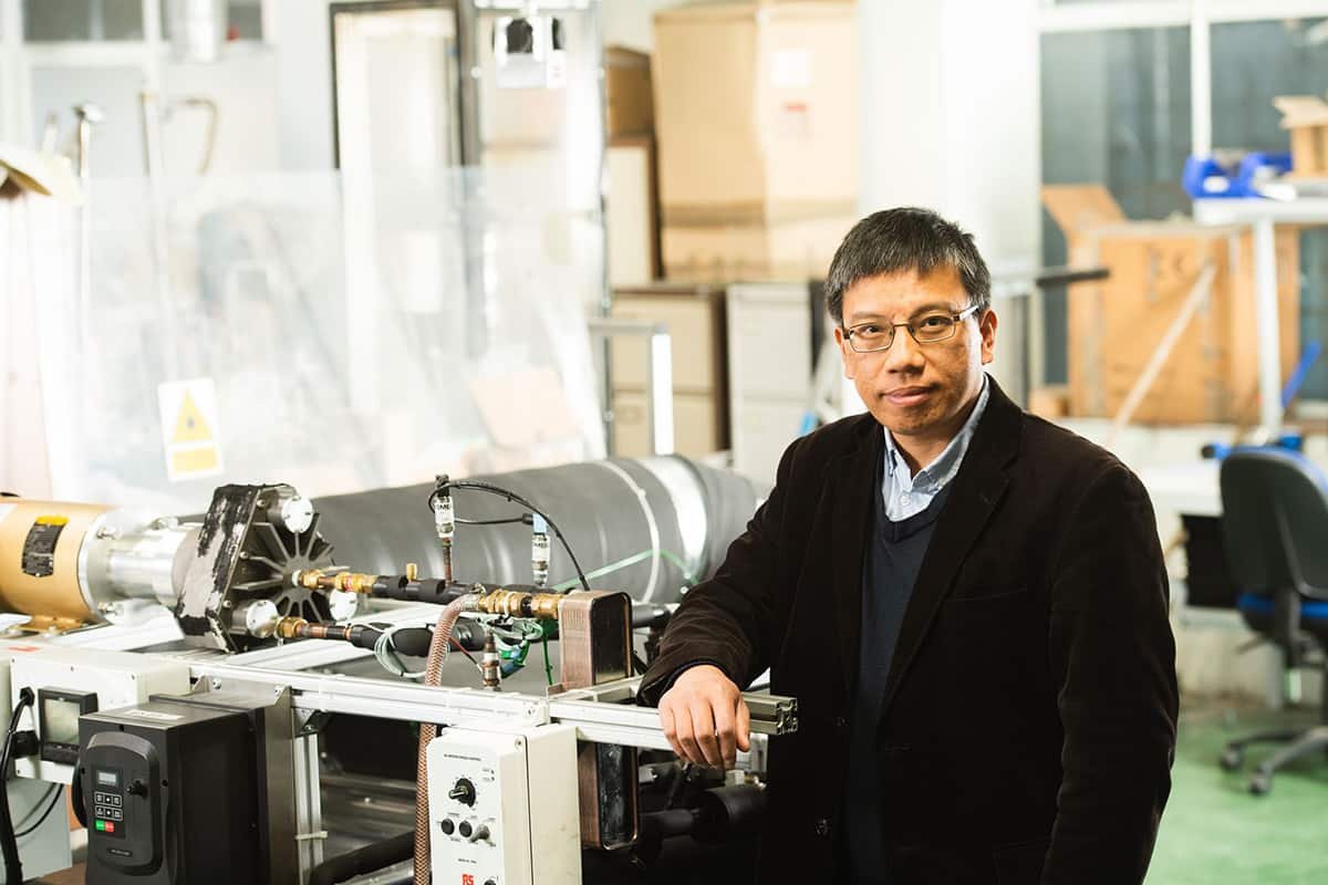 Zhibin Yu with a prototype heat pump