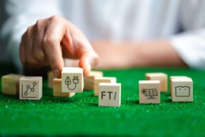 Hand moving blocks with FTI's Path to Smarter Energy icons