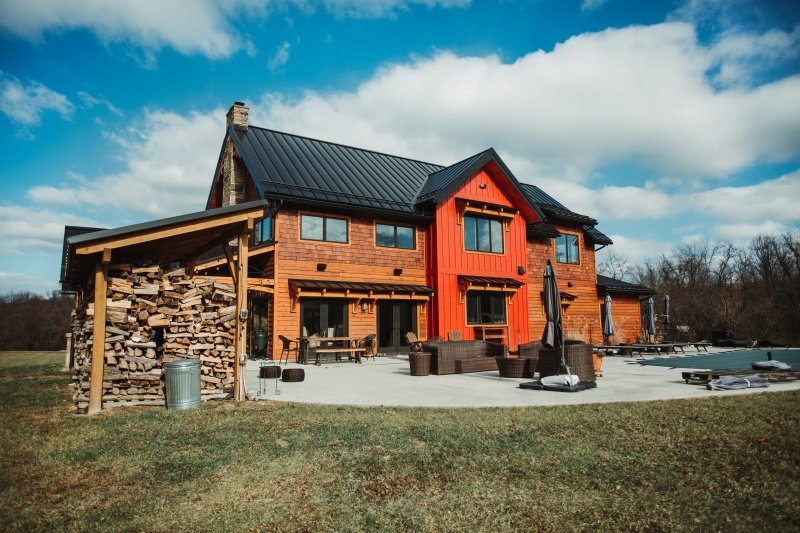 exterior view of country-style prefab SIP home with wood siding; by SIP panel supplier PanelWrights - photo