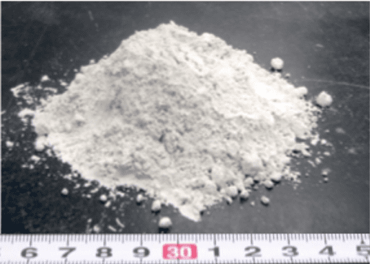 A mound of white powder heaped on a flat surface - Earth silica