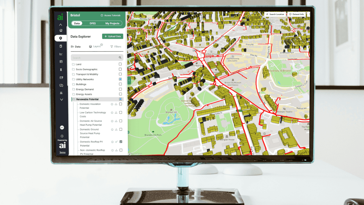 A desktop monitor screen displays a dashboard incorporating an isometric-view map - of Britsol, it seems - in addition to different areas of text and boxed text