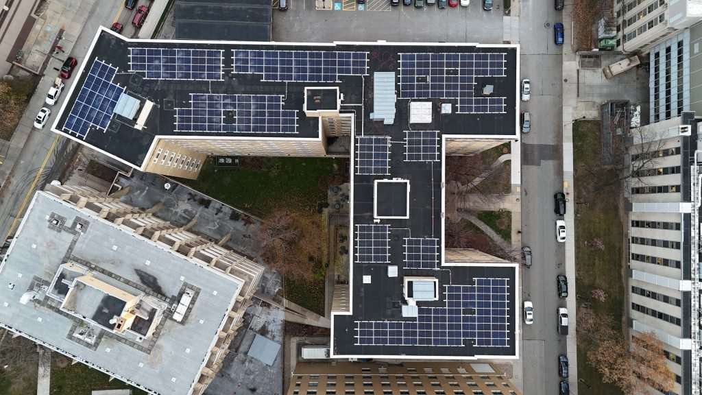 A birds-eye-view shot of the solar panels on Ruskin Hall.