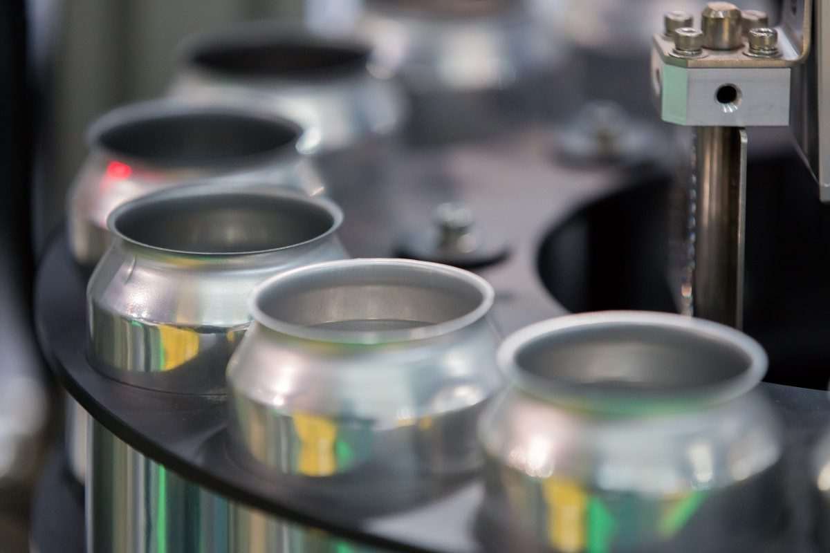 aluminium cans on circular conveyor belt or manufacturing system of some kind