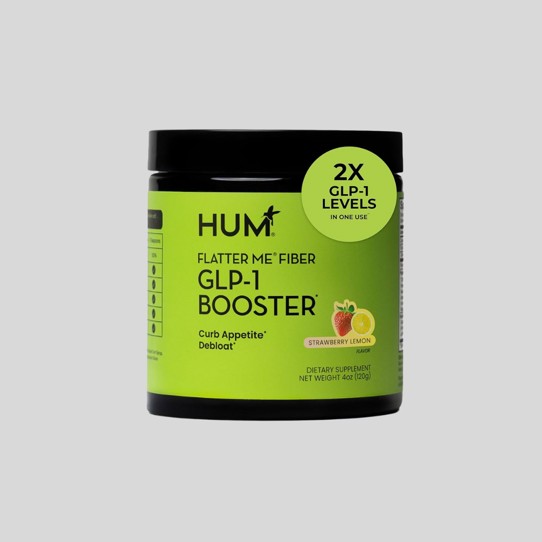 A container of HUM Flatter Me Fiber GLP-1 Booster dietary supplement, strawberry lemon flavor, with a label highlighting "2X GLP-1 Levels" and "Curb Appetite Debloat.