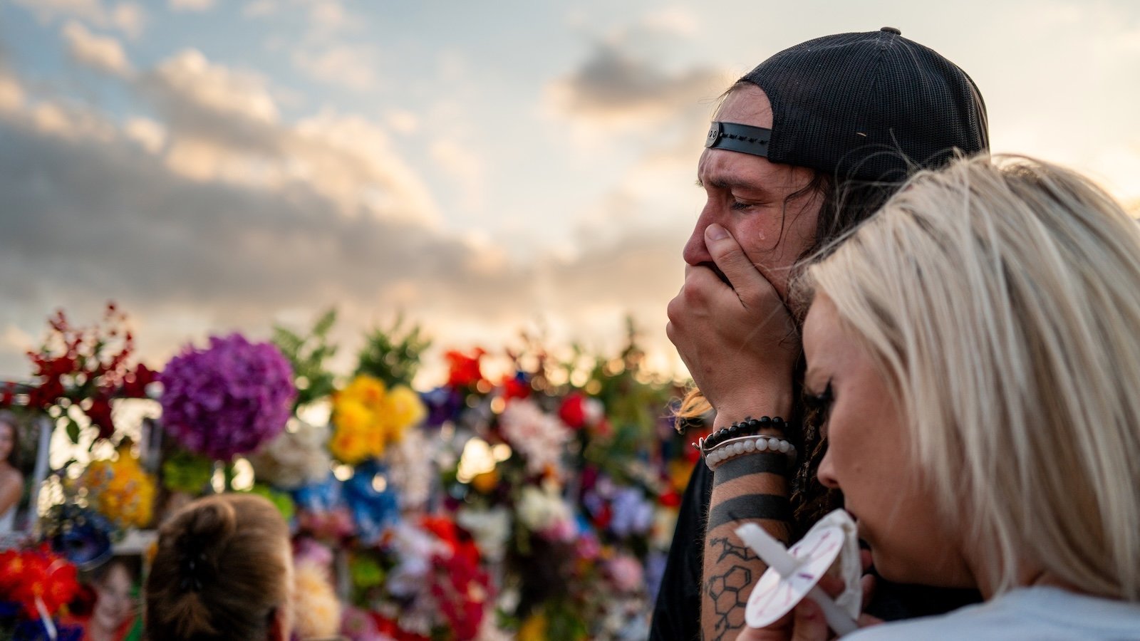 Community members grieve during a candlelight vigil to honor the lives lost in the flash floods that claimed more than 120 lives on July 11, 2025 in Kerrville, Texas.
