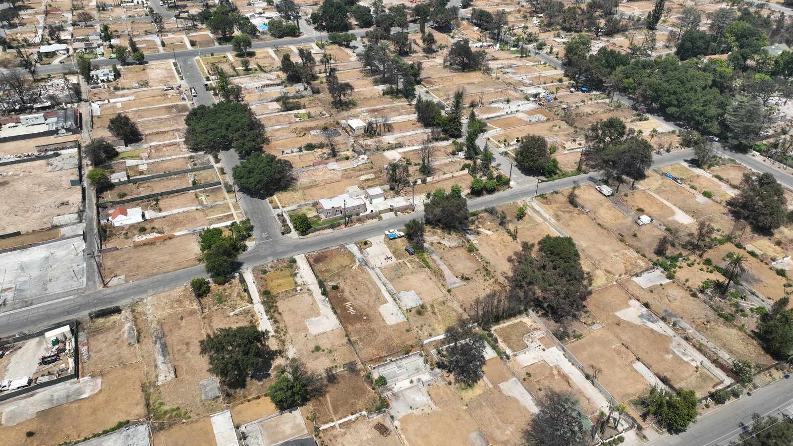 A aerial view of mostly cleared properties after Eaton Fire, taken in July. The fires destroyed thousands of homes, displacing residents into what was already one of the nation's tightest housing markets.