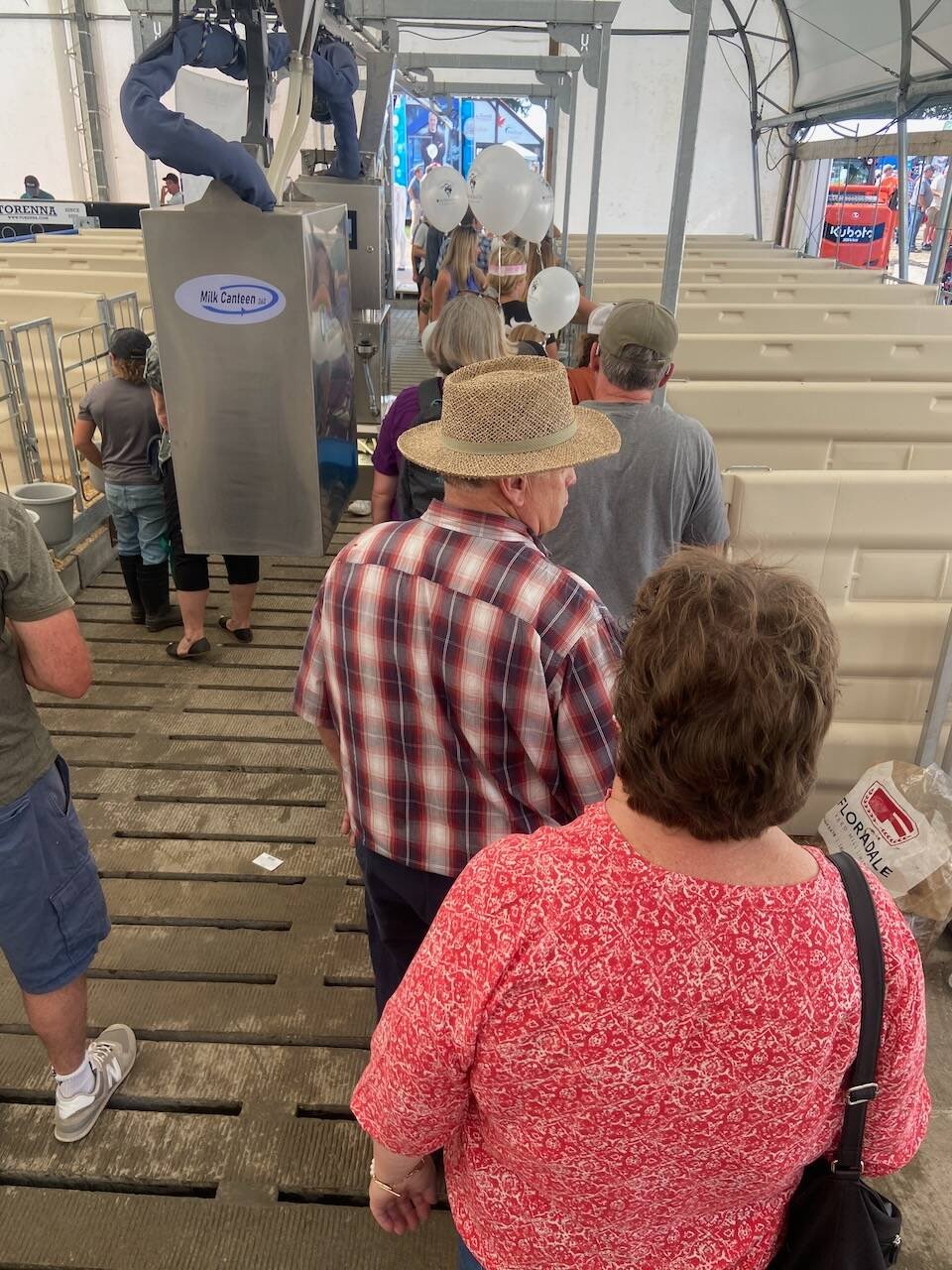Visitors tour the calf feeding demonstration at Canada’s Outdoor Farm Show. Photo: File