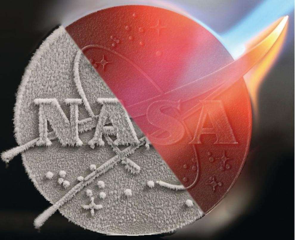 A metallic cast of the NASA insignia. Half of the disk is silver, while the other half is ablaze, subjected to high heat.