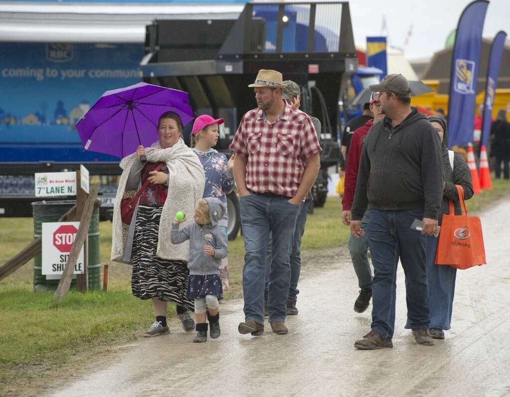 Attendees in the rain at Canada's Outdoor Farm Show