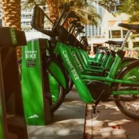 Green bicycles at a bicycle docking station