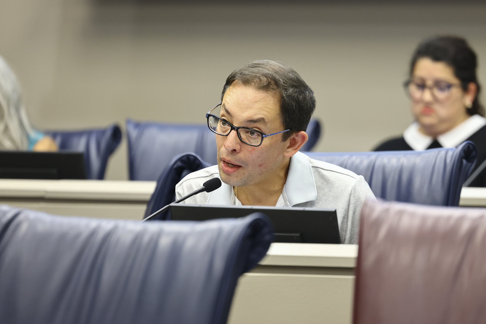 A man speaks into a microphone