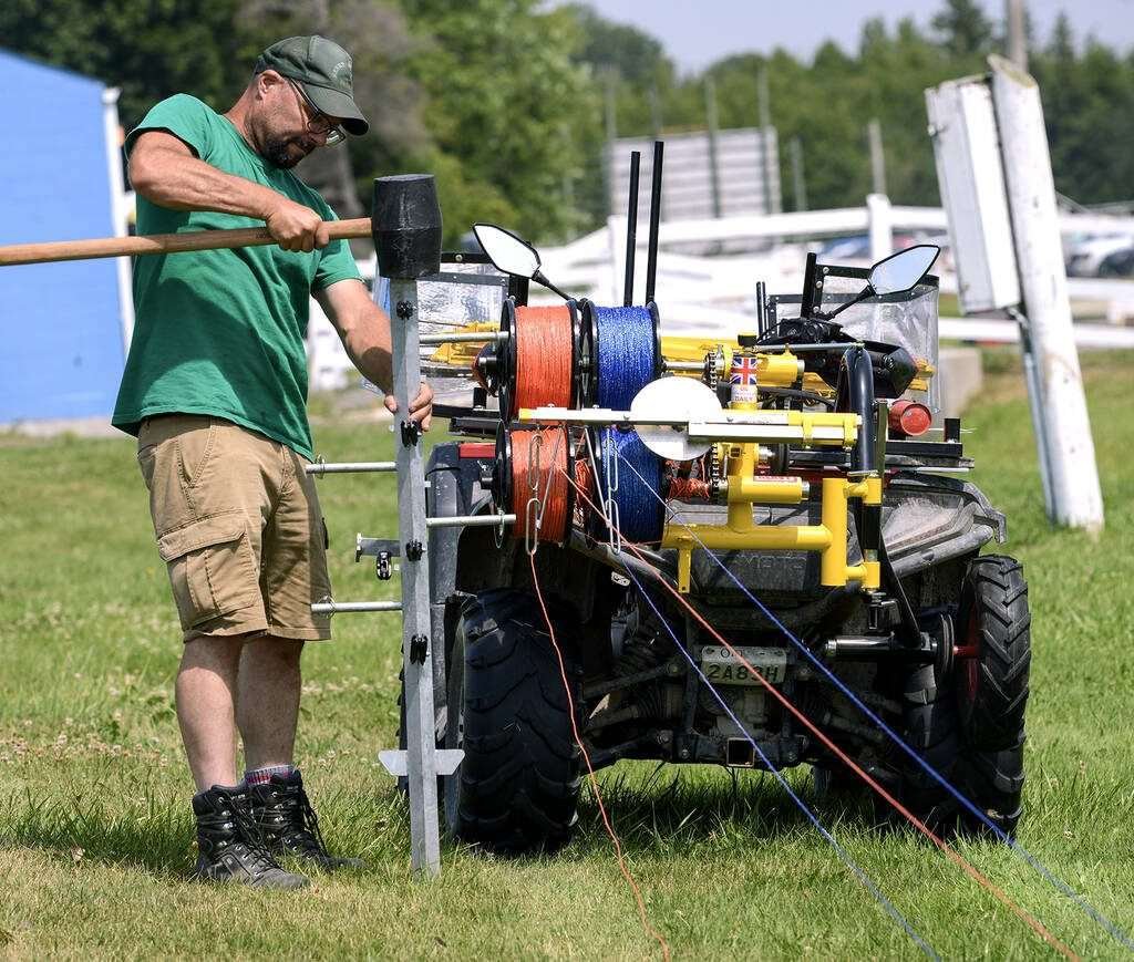 Chris Moore, Eastern Canada Rappa dealer and Shady Creek Lamb Co. co-owner, demonstrates the ease with which the Rappa ATV unwinder/winder system reels fencing in and out during the Ontario Sheep Field Day in Orono, Ont., July 24, 2025. Photo Diana Martin 