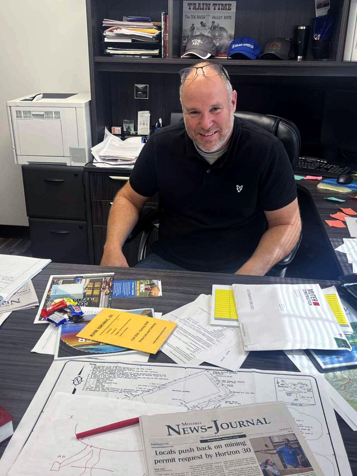 Photo of Allen Cook sitting at a desk