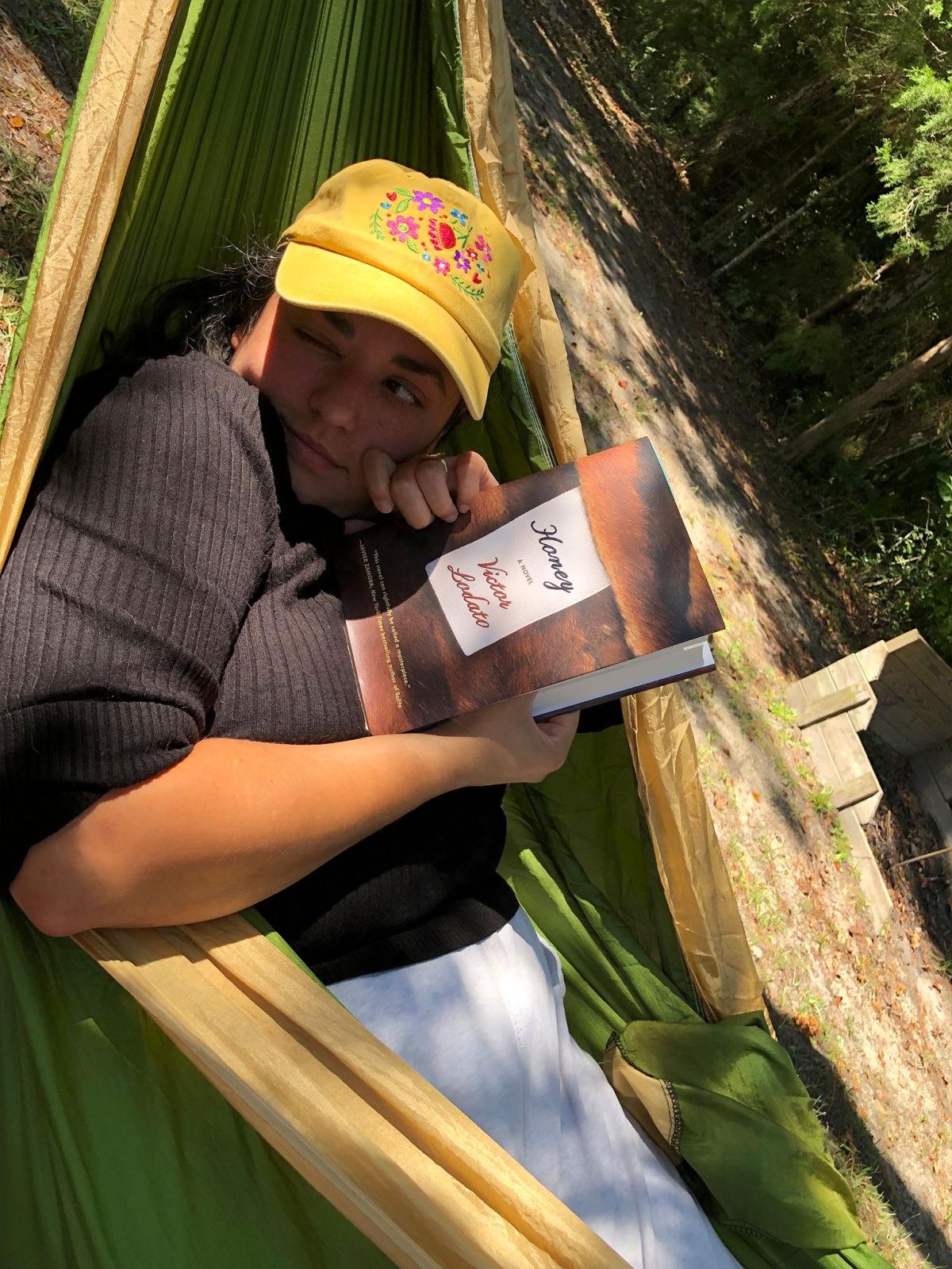 Photo of Kelsey Sanchez lying in a hammock