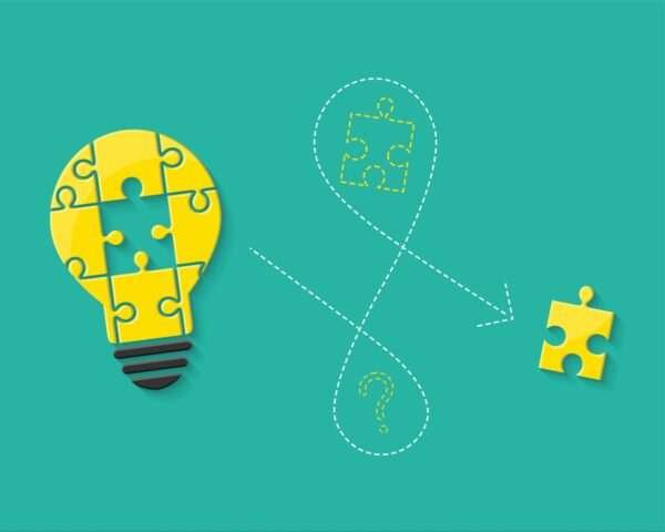 An image of a lightbulb made of puzzle pieces