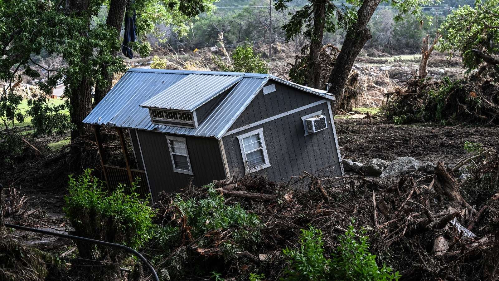 A damaged house is seen near the Guadalupe River in Hunt, Texas, on July 8, 2025.