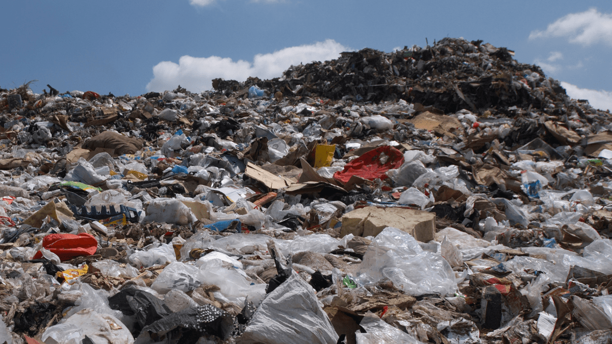 A landfill site with blue sky overhead