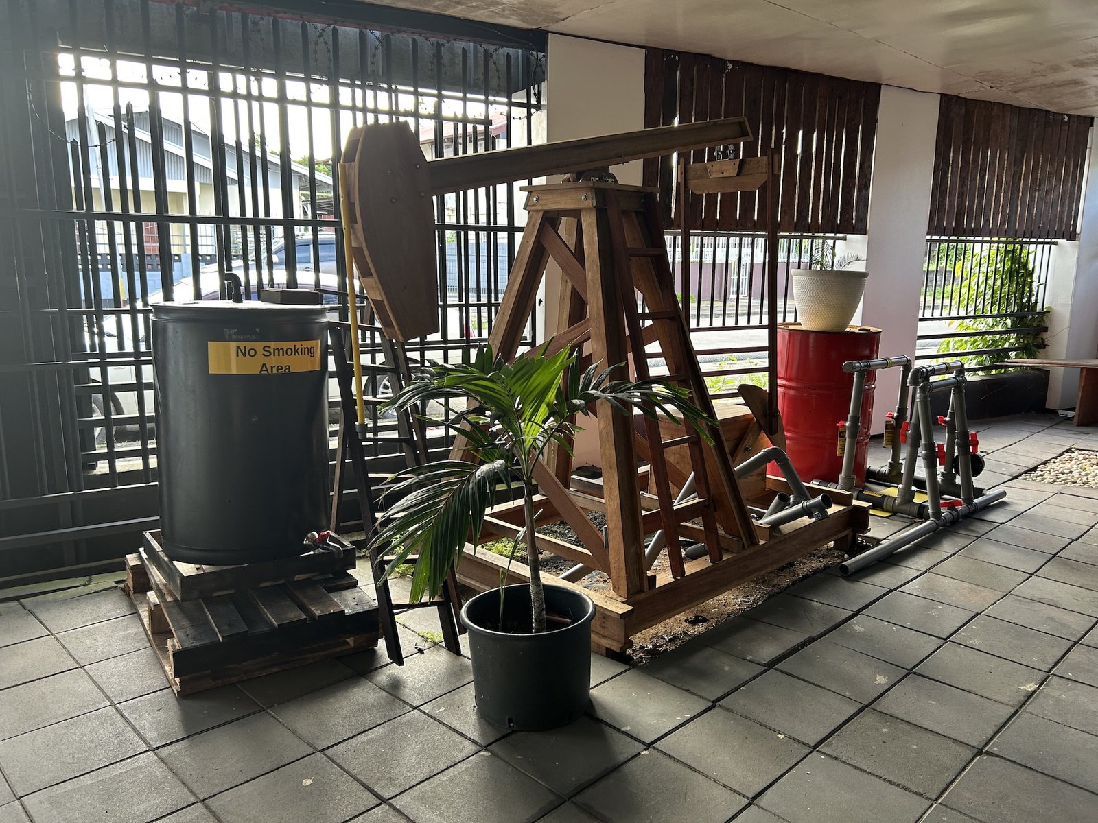A statue of an oil derrick inside a bar