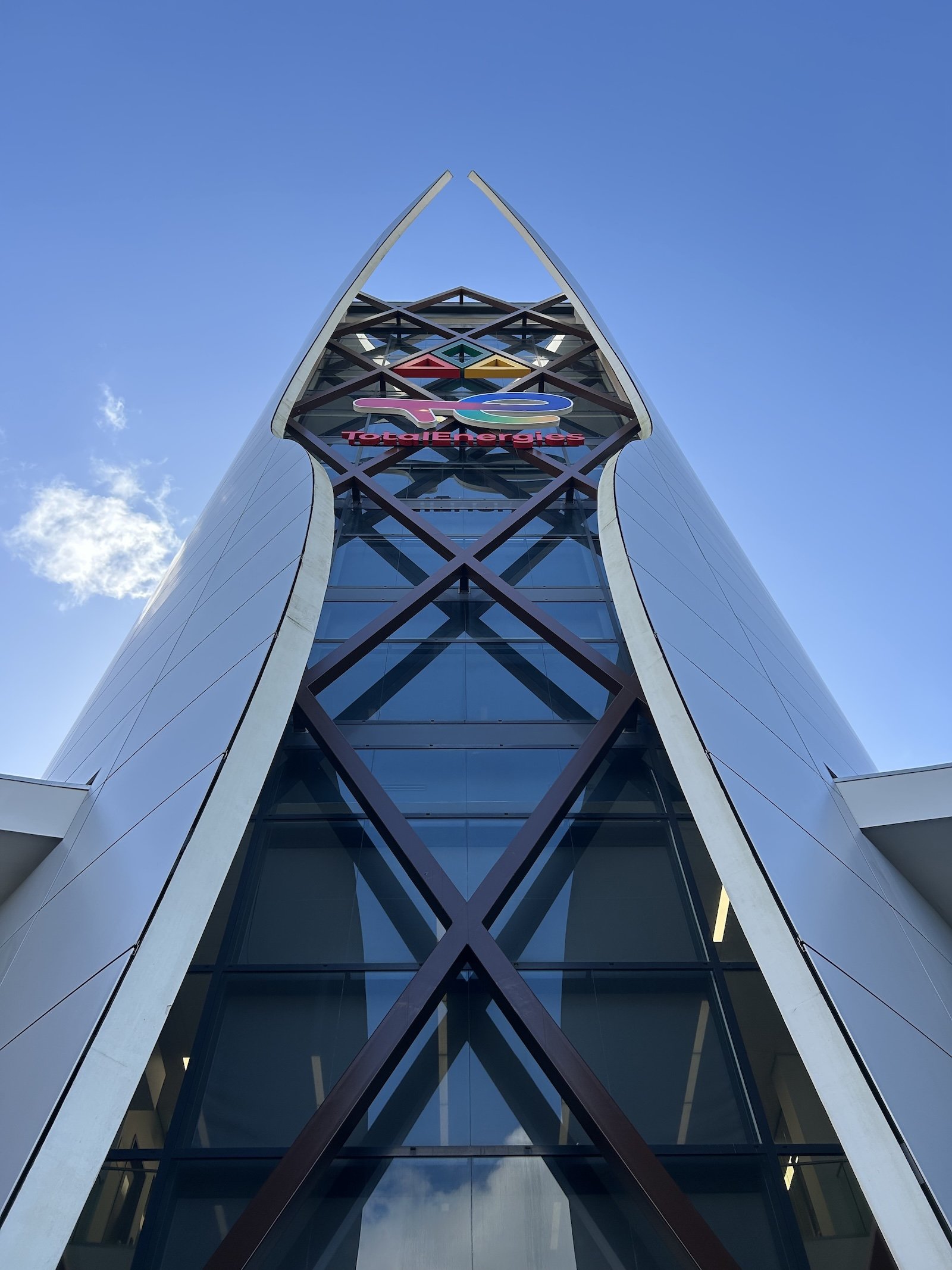 A view of the front of TotalEnergy's headquarters in Suriname taken from the base of the main tower and looking straight up