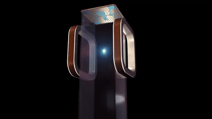 Six red lasers shine into the middle of a clear, rectangular chamber, fixating on a small, blueish white sphere.