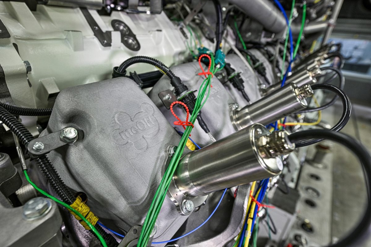 A complex metallic electromechanical assembly comprising cuboidal structures, cylindrical elements and wiring