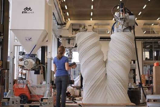 Person working on 3D printing a column from   White Tower by Studio Benjamin Dillenburger + Michael Hansmeyer. Image © Girts Apskalns