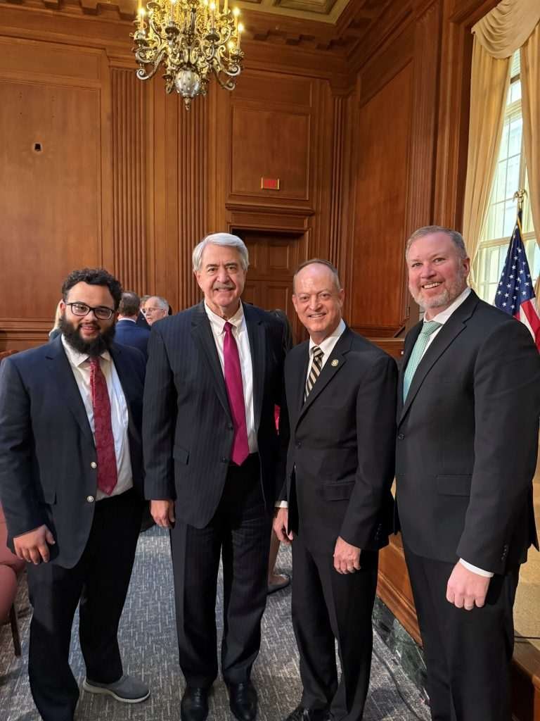 Four men pictures at the U.S. EPA office. 