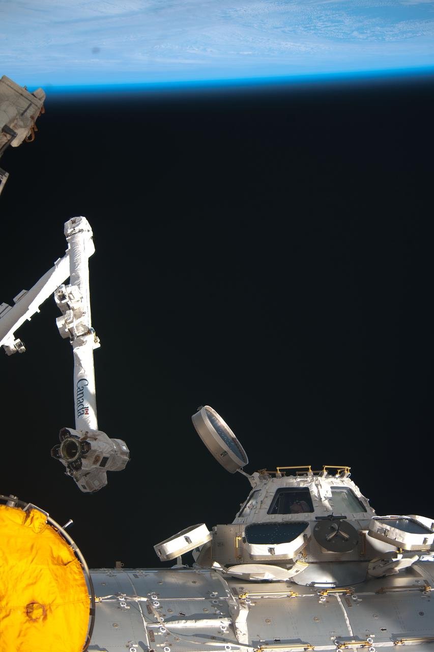 NASA astronaut Don Pettit, Expedition 30 flight engineer, is pictured in a window of the cupola of the International Space Station, backdropped by Earth’s horizon and the blackness of space.
