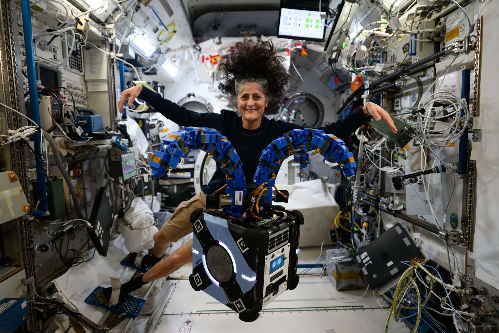 NASA astronaut and Expedition 72 Commander Suni Williams onboard space station with the Astrobee robotic free-flyer in the Kibo laboratory module.