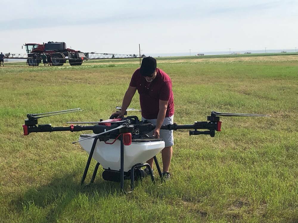 A drone tank is filled prior to a spraying demonstration in 2024 at the Ag In Motion farm show near Langham, Sask. Photo: File