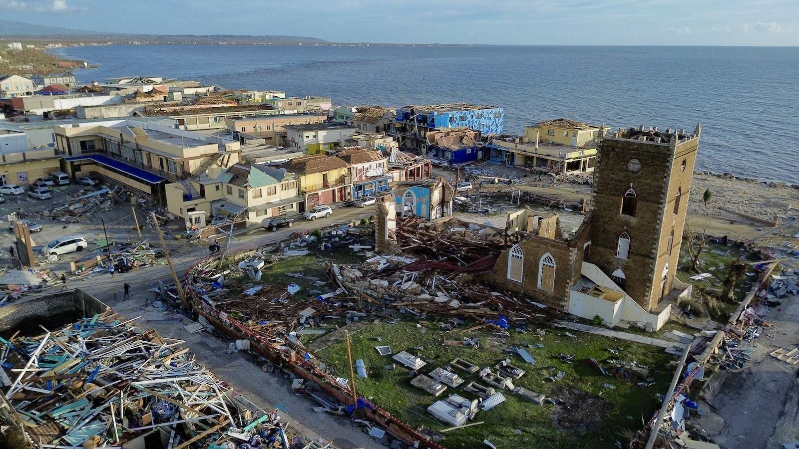 A hurricane ravaged coastal town on a sunny day