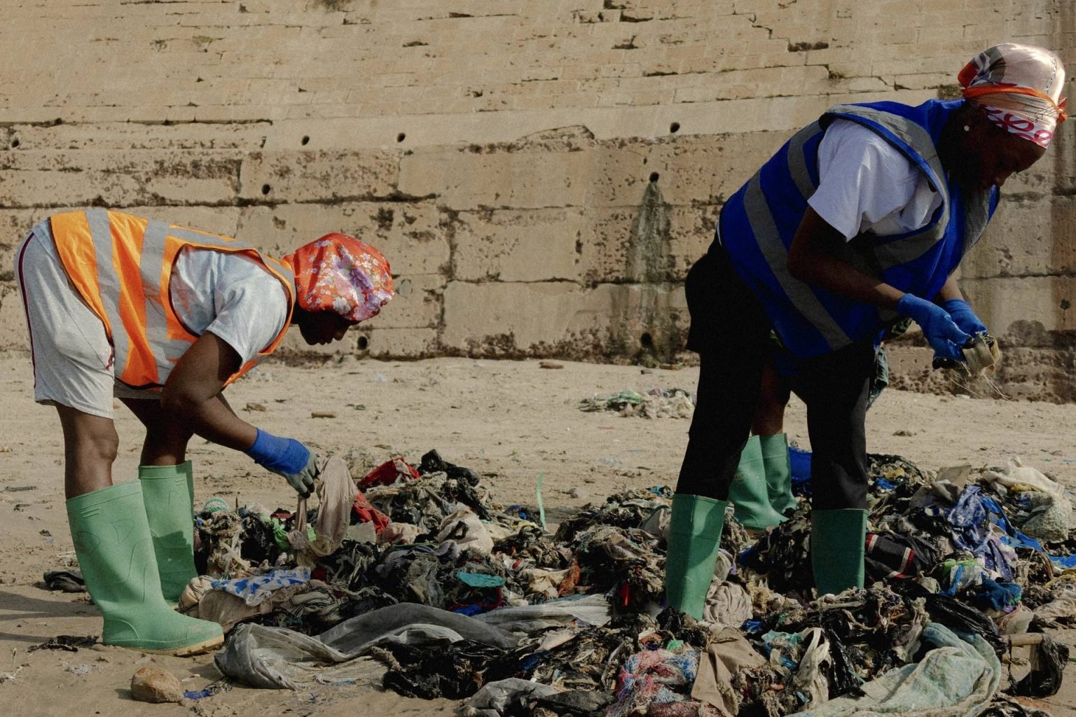Members of the Tide Turners crew identifying tags during the teams weekly cleanup at the King Shasha beach