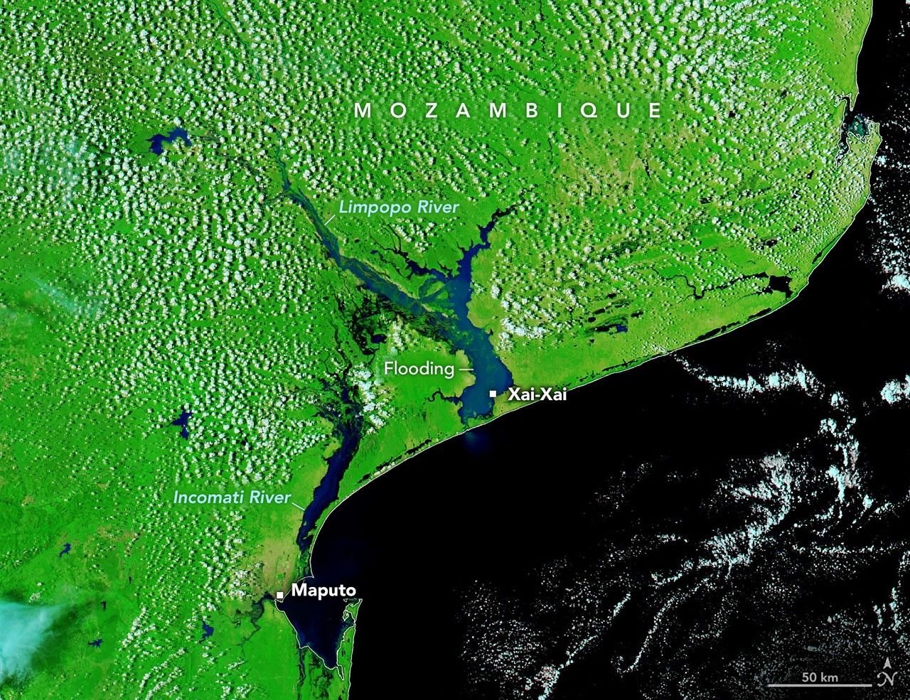 Water fills broad plains along the Incomati and Limpopo Rivers in Mozambique in a false-color image captured on January 25, 2026. Floodwaters appear dark blue, while the surrounding landscape is green. Labels mark the locations of Xai-Xai and Maputo.
