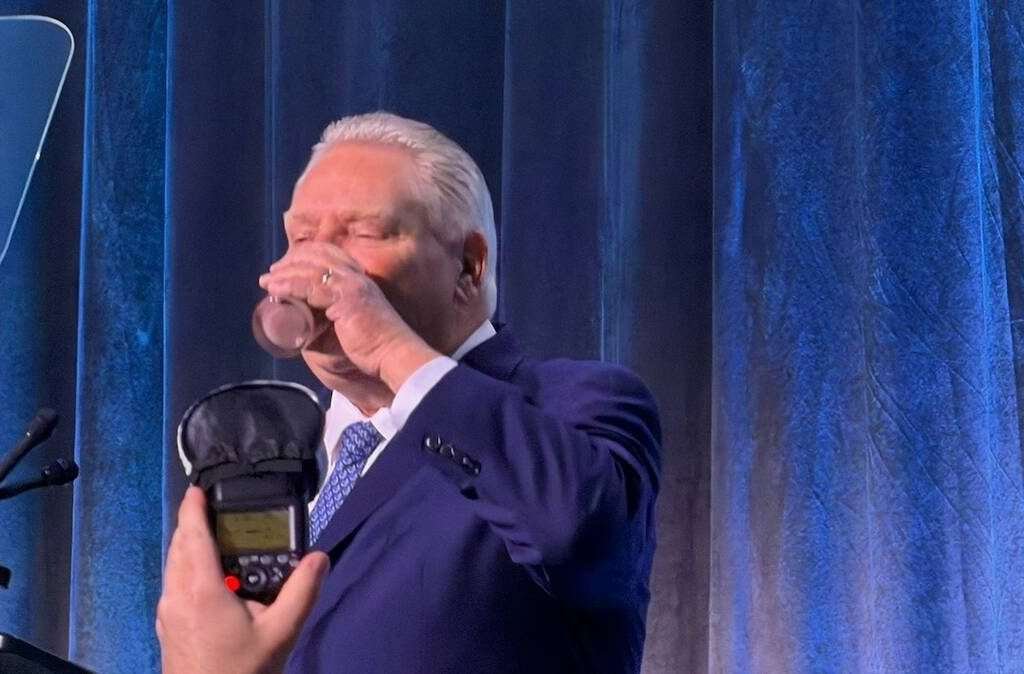 Ontario Premier Doug Ford drinks a glass of chocolate milk at the 2026 Dairy Farmers of Ontario annual general meeting in Toronto. Photo: John Greig